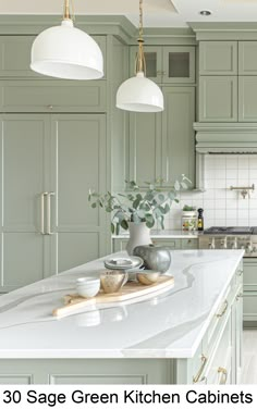 an image of a kitchen setting with green cabinets and white counter tops in the middle