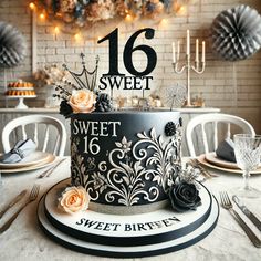 a black and white cake sitting on top of a table