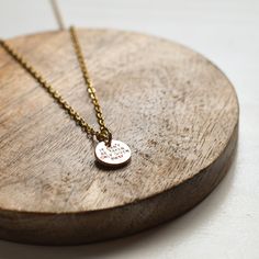 Embrace your faith and inner strength with our exquisite “Protect Your Hope Necklace.” Crafted from high-quality golden stainless steel, this necklace is more than just a piece of jewelry; it’s a powerful symbol of resilience and unwavering hope. Product Features: - Premium Material: Made from durable golden stainless steel, ensuring longevity and resistance to tarnish, so your necklace remains as radiant as your spirit.- Inspirational Charm: The 10mm charm is delicately engraved with the words “Protect your hope” alongside a beautifully crafted flame, symbolizing the enduring light of God within.- Meaningful Message: The reverse side of the charm carries the profound message, “It can’t be taken, only given away,” serving as a constant reminder of the strength and choice inherent in hope.- Inspirational Nickel-free Gold Necklace, Inspirational Gold Round Pendant Jewelry, Meaningful Engraved Stainless Steel Necklace, Gold Dainty Necklace For Promise, Dainty Gold Necklace For Promise, Inspirational Gold Pendant Jewelry, Stainless Steel Round Pendant Necklace Cadmium-free, Meaningful Gold Jewelry For Promise, Meaningful Gold Promise Jewelry