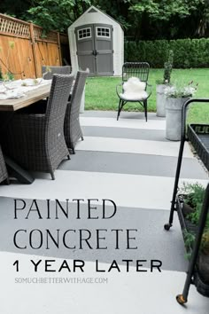 an outdoor dining area with chairs, table and potted plants