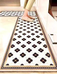 a person standing on top of a kitchen floor