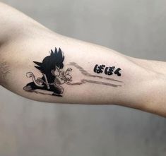 a man's arm with a cartoon character on it and the words go get