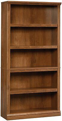 a wooden bookcase with three shelves