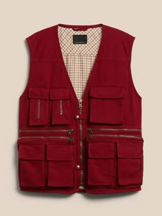 Spirited and resourceful, this rugged vest is modeled after a '90s style from our archives complete with 15—fifteen!—multifunctional pockets to store everything imaginable from cellphones to spare film canisters.  Reissued for the digital age, ou Utility Vest With Pockets For Adventure, Utility Vest With Multiple Pockets For Travel, Utility Travel Vest With Multiple Pockets, Retro Vest With Pockets, Film Clothes, Photographer Vest, Man Vest, Vest Design, Mens Smart Casual Outfits