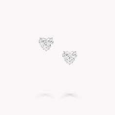 The heart is a timeless romantic motif, and nowhere is it more powerful than when presented in diamonds of exceptional beauty. Part of the Classic Graff collection, these heart shape diamond stud earrings are a symbolic take on our iconic diamond studs. Our diamond experts searched through thousands of heart shape diamonds to discover a pair, that perfectly complement one another. Crafted in minimalist platinum and white gold, the purity of design allows each diamond’s incomparable beauty to shi Graff Stud Earrings, Graff Earrings, Heart Shaped Diamond Earrings, 2024 Gold, Graff Jewelry, Graff Diamonds, Round Diamond Pendant, Round Diamond Earrings, Diamond Earrings Studs Round