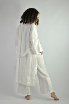 "This is our no. 60 of Conscious Clothing Concept #stayhome This lovely white A-line loose fitting robe is made of pure quality linen. Very modern approach to traditional white spa gown. It has got very flattering wide sleeves that match the bottom of the dress. This unique piece of loungewear can be very versatile. It is great and comfy to wear around the house, hotel or spa. It can be treated as the dress or loose shirt over the shorts for summer look. Perfect for home and the beach. It is the Open Front White Dress For Daywear, White Relaxed Fit Dress For Loungewear, Chic White Kimono For Spring, White Open Front Dress For Daywear, White Kimono Sleeve Dresses For Loungewear, Chic White Open Front Kimono, Chic White Kimono With Kimono Sleeves, White Oversized Robe For Spring, Long White Robe For Spring