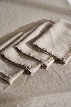 four folded linens sitting on top of each other