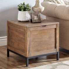 Store your essentials stylishly with the iNSPIRE Q Storage Trunk End Table with Removeable Tray by iNSPIRE Q Artisan. Featuring a warm brown wood finish and black metal base for a rustic contrast. The trunk table stores plenty of items that tuck away and has a wood tray. The wood tray is removable so that you can not only place items on top but take your items with you. The contemporary table blends well in any space and is perfect for a family that needs a stylish space saving solution. Feature Rancher Homes, Trunk End Table, Trunk Table, Storage Trunk, Contemporary Table, End Tables With Storage, Wood Tray, Warm Brown, Table Storage