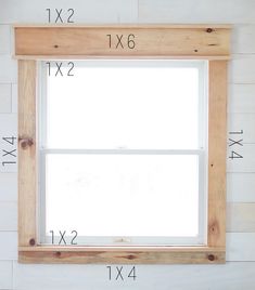 the measurements for a window frame are shown in front of a white wall with wood planks