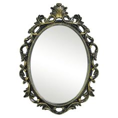 an ornate mirror is shown against a white background