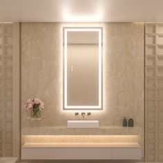 a bathroom with a large mirror above the sink and lights on the wall behind it