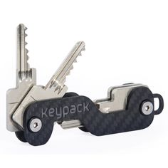 two keys attached to each other with the word keypack written on them in black