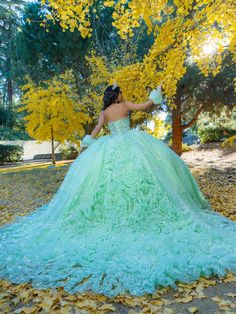 Receive lots of compliments in this floral glitter applique long strapless corset dress with an A-line skirt from LizLuo Quince by the House of Wu 26094. This stunning quinceañera ball gown boasts a one-of-a-kind beaded pattern that accentuates the entire bodice. The basque waistline shapes and frames the full ball gown skirt, while the floral glitter fabrics create an ultimate sparkle effect. Additionally, sheer ruffle fingerless gloves add a sweet touch to the ensemble. House of Wu LizLuo Quin Torquise Quince Dresses, Teal Quinceanera Dresses, Quince Hair, 1500 Dresses, Strapless Corset Dress, Strapless Ball Gown, Military Ball Dresses, Champagne Dress, Quince Dress