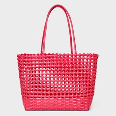 From beach hangs to weekend brunches, elevate your sunny weather look with this Woven Cage Tote Handbag from Shade & Shore™. This structured tote handbag features a single compartment for stashing essentials like towels, hats, sunscreen and more, while the open-top design allows for easy access. Designed in a solid hue with an open-weave design, it sports double tote handles for easy carrying. Shade & Shore™: Found exclusively at Target. Modern Summer Straw Bag For Beach, Modern Pink Shoulder Bag For Summer, Modern Shoulder Bag For Spring Vacation, Modern Double Handle Shoulder Bag For Beach, Modern Bags For Spring Vacation, Modern Double Handle Beach Shoulder Bag, Modern Spring Vacation Bags, Modern Shoulder Bag For Spring Beach Outing, Modern Shoulder Bag For Spring Beach