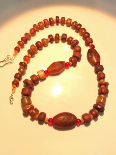 A beautiful collection of very old ancient Carnelian Beads , Carnelian Beads, . They are found in Afghanistan, India, Pakistan and Tibet. They can be used to make a beautiful contemporary designed necklaces. Each bead is authentic and old. Highly collectible 9 pictures are there you can swipe each to see all pictures silver lock 95.5with the necklace Handmade Spiritual Carnelian Beads, Amber Carnelian Necklace With Polished Beads, Artisan Red Carnelian Beaded Necklace, Artisan Red Carnelian Beaded Necklaces, Brown Carnelian Beaded Jewelry, Artisan Carnelian Beads For Gifts, Brown Carnelian Gemstone Necklace, Brown Carnelian Gemstone Necklaces, Handmade Carnelian Beads For Jewelry Making