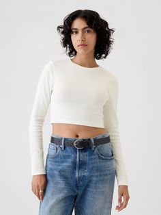 Soft cotton-blend knit cropped T-shirt.  Crewneck.  Long sleeves.  Fit: Stretch-to-Fit.  Slim & stretchy that forms to your shape.  Cropped, hits at the waist.  Models wearing Gap Gap Cropped Tops For Spring, Fitted Casual Cropped T-shirt For Fall, Gap Casual Crop Top For Spring, Fitted Cropped Top By Gap, Casual Gap Crop Top For Spring, Fitted Gap Crop Top For Spring, Fitted Casual Crop Top By Gap, Trendy Stretch Tops By Gap, Trendy Stretch Tops From Gap