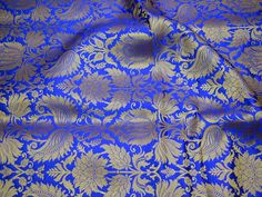 Royal Blue Brocade Banarasi Fabric by the Yard Banarasi Brocade for Wedding Dress lehenga Skirt Costume Crafting Home Decor Table Runner. This is a beautiful heavy benarse art silk brocade floral design fabric in Royal Blue and Gold. ➤Product: Brocade Fabric ➤Fabric Type: Blended Silk (Viscose and Silk) Fine quality Zari Brocade Weaving from Banarasi ➤Color: Royal Blue and Gold ➤Width: 44 inches. ➤Condition: New ➤Code: bg1184 ➤Listing for 1 Yard of fabric. ➤Care: Dry Clean Only You can use this Banarsi Dress, Royal Blue And Gold Wedding, Wedding Gown Indian, Gown Indian Wedding, Wedding Dress Lehenga, Dresses For Big Bust, Banarasi Brocade Fabric, Summer Wedding Gowns, Banarasi Fabric