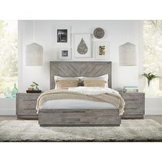 a bedroom with a bed, dresser and pictures on the wall above it's headboard