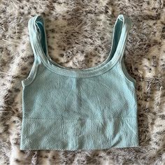 Never Worn Summer Workout Crop Top, Light Blue Stretch Crop Top For Summer, Blue Seamless Tank Top For Spring, Sporty Cotton Crop Top For Beach, Light Blue Seamless Sleeveless Crop Top, Light Blue Sleeveless Seamless Crop Top, Beach Tank Crop Top, Sporty Scoop Neck Crop Top For Beach, Stretch Tank Crop Top For Beach