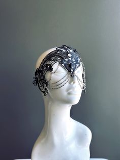 Step into the realm of goddesses with our women's masquerade mask in black. Rhinestones delicately embellish the mask, adding a touch of sparkle. Silver chains gracefully adorn the mask, creating an enchanting movement. Capture attention at any masquerade party, ball, or themed event!


Age Group/Gender - Adult/Women

Size/Type - One size fits all adults

Mask Color - Black

Mask Material - Laser Cut Metal

Special Features - Chains and rhinestones Dark Masquerade Mask, Celestial Masquerade Mask, Moon Masquerade Mask, Fairy Masquerade, Elegant Masquerade Mask, Masquerade Ball Outfits, Ball Outfits, Masquerade Mask Women, Black Masquerade