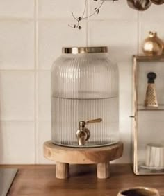 a glass container sitting on top of a wooden table