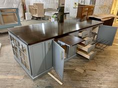 a kitchen island made out of cabinets and drawers