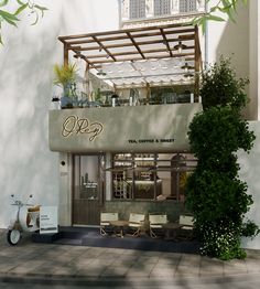 the outside of a restaurant with an awning over it's balcony and patio