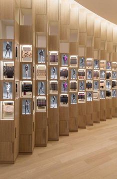 a room with wooden walls and pictures on the wall in it's display cases