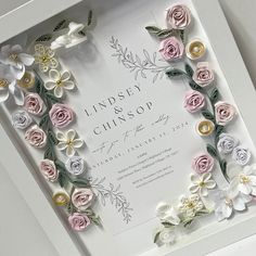 a wedding card with paper flowers in it