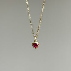 Get swept up in a rosy glow with this sweet, steadfast ruby heart pendant. 18k yellow gold Ruby, 0.42ct, 4mm x 5mm (3/16" x 3/16")Chain is 18" long Hearts Necklaces, Ruby Heart Necklace, Ruby Heart Pendant, Ruby Chain, Heart Necklace Gold, Ruby Heart, Newport Ri, Ruby Necklace, Gold Heart Necklace