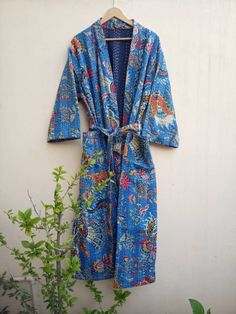 This Kimono is made of hand Kantha stitch fabric in patchwork . The fabric is a handmade printed fabric. Kantha stitch over the fabric gives it a unique look. It is two Layer of Cotton Kantha Stitch (Hand Quilted) Fabric Robe Size : Free size Length: 50 Inch ( 125 Cms.). Multicolor Cotton Dresses, Blue Bohemian Sleepwear For Home, Fitted Blue Sleepwear For Home, Blue Cotton Kimono For Loungewear, Fitted Multicolor Cotton Kimono, Blue Bohemian Long Sleeve Sleepwear, Fitted Multicolor Cotton Sleepwear, Multicolor Cotton Robe For Festival, Multicolor Long Cotton Robe