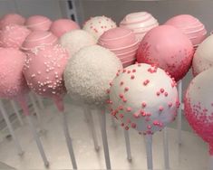 there are many pink and white cake pops