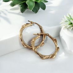 Handcrafted leaf hoop earrings in 14k or 18k solid gold. These floral branch hoops are a great anniversary gift or Valentine's Day gift for that special someone. A beautiful everyday accessory to add to your collection.  Each design was created in wax to mimic a flowing combination of 5 leaves, twigs and vines. By choosing our handcrafted earrings, you're not only treating yourself or a loved one to a piece of wearable art, but you're also supporting authentic craftsmanship. Add these enchanting Nature-inspired Gold Earrings For Anniversary, Nature-inspired Yellow Gold Jewelry With Matching Earrings, Gold Nature-inspired Hoop Earrings, Nature-inspired Gold Hoop Earrings, Nature-inspired Small Hoop Jewelry For Gifts, Nature-inspired Small Hoop Jewelry As Gift, Nature-inspired Small Hoop Jewelry Gift, Nature-inspired Yellow Gold Nickel-free Jewelry, Nature-inspired Gold Hoop Earrings For Pierced Ears