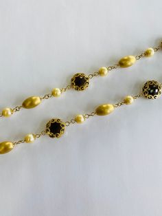 "This is a vintage 18K (high-karat) yellow gold, brown/smokey topaz, and pearl necklace. The necklace pattern alternates from a smooth-textured gold beads, to pearls, to ornately gold-wrapped brown/smokey topaz. Material(s): 18K yellow gold + pearl + brown/smokey topaz Total weight: 45 grams Flaws (if any): None to mention Marking(s): \"750\" (translating to \"18K\") + \"Italy\" Measurements: This necklace measures 23 1/2 (or 23.5) inches in length. If you have any questions about this necklace, Elegant Handmade Antique Gold Necklace, Antique Gold Heirloom Necklace For Formal Occasions, Elegant Antique Gold Necklaces For Party, Elegant Antique Gold Necklace For Parties, Heirloom Antique Gold Necklace For Formal Occasions, Classic Formal Vintage Charm Necklaces, Gold Victorian Necklace For Evening, Elegant Formal Necklace With Vintage Charm, Victorian Gold Necklace For Evening