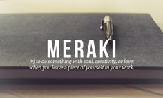 a notepad with the words merak written on it and a pen resting on top