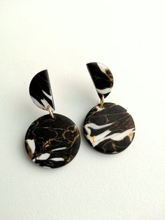 pair of black and white marbled earrings