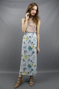 Vintage nineties BLUE FLORAL MAXI SKIRT. Partial elastic waist. Back zipper + button. 17 inch slits on both sides.Model is 5'9. Her measurements are: bust=34 inches, waist=26 inches, & hips=34 inches. The skirt fits as shown on her.We measure on a flat surface from seam to seam. Bust, waist, & hip measurements have already been doubled. We suggest you compare our measurements to a garment you already own and know fits you well to ensure a proper fit.label: rikki j new york approximate si Blue Fitted Maxi Skirt For Spring, Fitted Blue Maxi Skirt For Spring, High Waist Relaxed Fit Pencil Skirt For Spring, High Waist Floral Print Maxi Skirt, Flowy Midi Skort For Summer, Relaxed Floral Print Pencil Skirt, Relaxed Pencil Skirt With Floral Print, Flowy High-waist Spring Maxi Skirt, High Waist Pleated Pencil Skirt For Summer