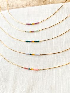 🌈 Thin gold plated chain with tiny Japanese seed beads in happy, bright colors. Choose between Gold Plated or Gold Filled materials. What's the difference? Gold filled materials contain 100x more real gold than the gold plated option and are very durable, tarnish resistant and will last for years. 📏Not sure which length to choose? Add a chain extender: https://etsy.me/34lPf3m To view more items from this shop, click the link below: https://www.etsy.com/shop/OceanBreakup 🌎 Packaging 🌎 To be e Colorful Beaded Necklace, Sundance Jewelry, Wire Jewelry Rings, Necklace Packaging, Bracelets Handmade Diy, Beaded Necklace Designs, Necklace Colorful, Beaded Necklace Diy, Gold Bead Necklace