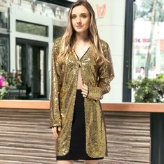 Make a statement with the Anna-Kaci Women's Sequin Open Front Cocktail Outerwear Jacket, a sophisticated and eye-catching piece perfect for any occasion. This shiny disco jacket boasts an open front with hook & closure and long sleeves, ensuring you'll stand out wherever you go. Glamorous Long Sleeve Fall Blazer, Glamorous Long Sleeve Blazer For Fall, Gold Long Sleeve Blazer For Party Season, Glamorous Long Sleeve Party Outerwear, Disco Sequin Outerwear For Fall, Trendy Outerwear For Night Out And Party Season, Trendy Outerwear For Party Season, Glamorous Long Sleeve Holiday Outerwear, Long Sleeve Spring Party Blazer