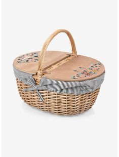 a wicker basket with floral designs on it