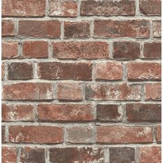 a brick wall that is made out of red and brown bricks, with no mortars on