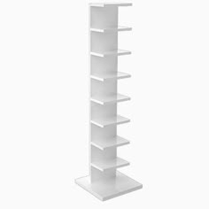 a white book shelf with five shelves on each side