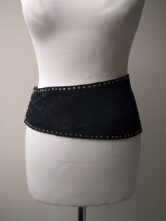 Vintage wide belt made of suede leather - asymmetrical with metal studs. From the 80s or 90s. Good vintage condition. No flaws that I could see. Mannequin is roughly 25 waist Wide Black Belt, Party Belts With Rivets, 2024 Predictions, 1950s Boys, 80s Belt, Beach Jacket, Belt Making, Digital Wardrobe, Suspender Belt