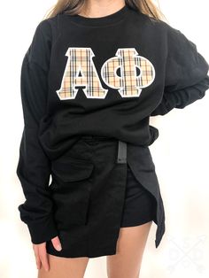 8.0 oz., 50% cotton / 50% polyester pre-shrunk fleece knit. Letters are embroidered.