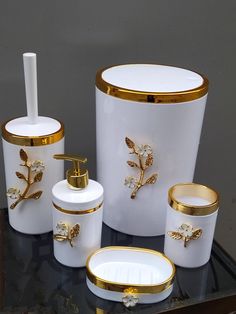 Stunning Acrylic Bath Set, White Bath Set with beautiful enamelled flower ornament, Acryclic Bath Set, Gold Bath Set  A beautiful Acrylic Bath Set typically includes items that enchance the aesthetic and functionality of Your Bathroom. Material ; Baskets and Cans are Acrylic , Stands are Metal. Why Acrylic ? Acrylic is favored for its durability, lightweight and modern appearance making them a popular choise for contemporary Bathrooms. When selecting an Acrylic Bath Set,consider the color,style and finish to ensure they match Your existing decor. Bath Set;  1 pcs Trash Basket 1 Pcs Liquid Soap Dispenser 1 pcs Solid Soap Dispenser 1 pcs Toothbrush Storage 1 Pcs Toilet Brush Can  Shipping with DHL Express . We Pack Safely and Ship to Your Door It is very important for us that you reach these White And Gold Bathroom, Golden Bathroom, Gold Bathroom Set, Gold Bad, Unique Kitchen Design, Bad Set, Gold Bathroom Accessories, Gold Bath, Toothbrush Storage