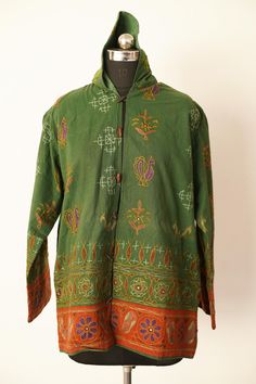 Welcome To Our Shop Product: One-Of-A-kind Handmade 100% Cotton Vintage Kantha Jacket. Color: Multi-color as Shown in Image. Fabric: 100% cotton ( Handmade In India ) The design of the jacket is very unique and very rare. Indian culture and associated with grace and beauty. Old hand made raali more then 1970s old pieces collected From villages Of Thar Desert converted into the vintage jacket and backside beautiful embroidery elephant work, This Raali belongs to higher caste people they give this Festive Green Outerwear With Stand Collar, Multicolor Cotton Outerwear With Stand Collar, Multicolor Festival Outerwear With Pockets, Vintage Cotton Outerwear For Festival, Traditional Green Outerwear With Stand Collar, Vintage Multicolor Outerwear For Festival, Traditional Green Stand Collar Outerwear, Green Bohemian Outerwear For Festival, Festive Long Sleeve Winter Outerwear