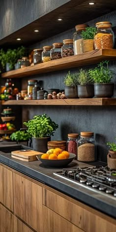 a kitchen filled with lots of pots and pans on top of a stovetop