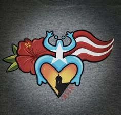 an image of a heart with wings and flowers painted on it's back side