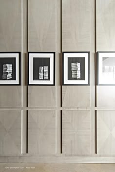 four black and white pictures hanging on the wall