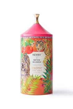 a pink bottle with an orange and white tiger on it's lid sitting in front of a white background